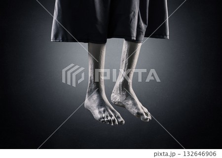 Zombie hanging legs over dark misty background at night Zombie hanging legs over dark misty background at night 132646906