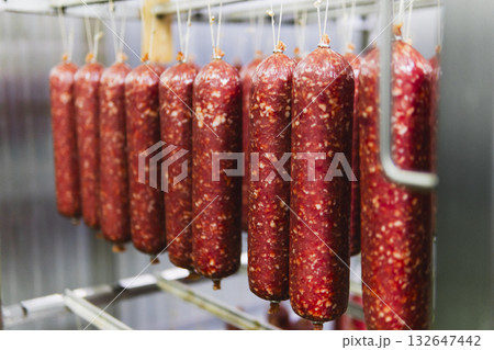 Smoked sausage production line in the factory Smoked sausage production line in the factory 132647442