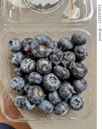 Large blueberries in a transparent plastic box. High quality photo Large blueberries in a transparent plastic box. High quality photo 132647855