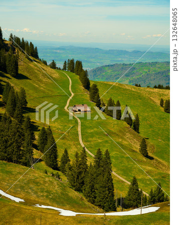 Scenic mountainscape with a rustic cabin surrounded by lush greenery and winding trails in a tranquil setting Scenic mountainscape with a rustic cabin surrounded by lush greenery and winding trails in a tranquil setting 132648065
