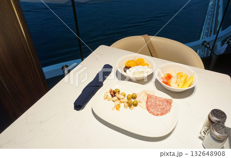 Dining Room Buffet aboard the abstract luxury cruise ship. Healthy breakfast at modern liner concept Dining Room Buffet aboard the abstract luxury cruise ship. Healthy breakfast at modern liner concept 132648908