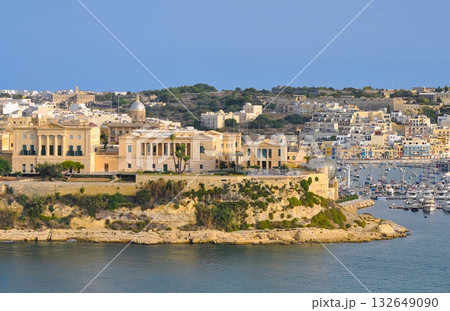 The historic Bighi Complex in Kalkara, Malta, featuring imposing architecture and coastal views along Triq Marina. Cultural heritage of Malta The historic Bighi Complex in Kalkara, Malta, featuring imposing architecture and coastal views along Triq Marina. Cultural heritage of Malta 132649090