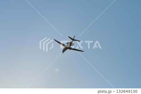 small plane flying low in the sky with space for text small plane flying low in the sky with space for text 132649130