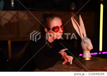 festive night sculpture, joyful nighttime scene featuring woman and rabbit sculpture celebration festive night sculpture, joyful nighttime scene featuring woman and rabbit sculpture celebration 132649209