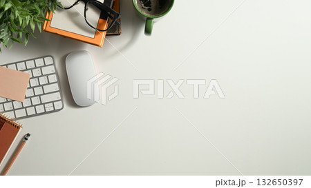 Minimalist top view workspace desk with computer, notebook, coffee Minimalist top view workspace desk with computer, notebook, coffee 132650397