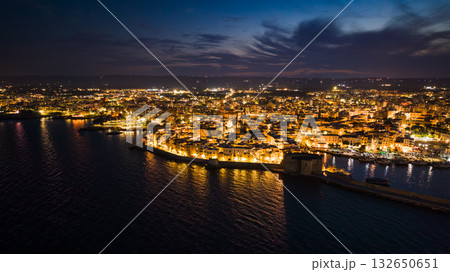 Night view of the illuminated old town, port and castle in Monopoli, Italy, from above Night view of the illuminated old town, port and castle in Monopoli, Italy, from above 132650651
