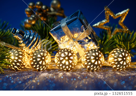 Golden lights enhance celebration atmosphere, Warm illumination creates cozy holiday party setting 132651555
