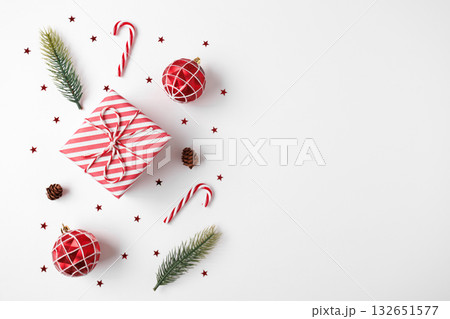 Christmas gift with decorations on white background 132651577
