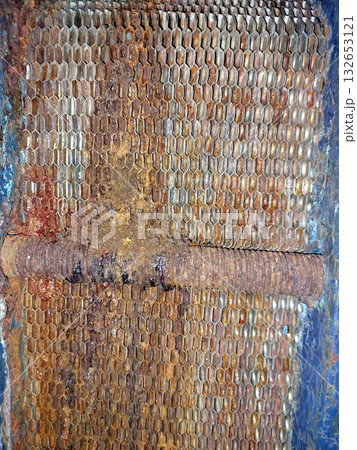 Detailed View of a Worn Industrial Plate Heat Exchanger Showing Corrosion and Residue 132653121