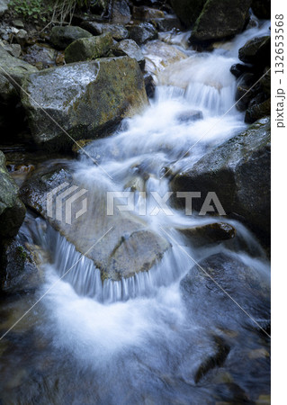 A mountain waterfall among rocks in the Carpathian Mountains in summer A mountain waterfall among rocks in the Carpathian Mountains in summer 132653568