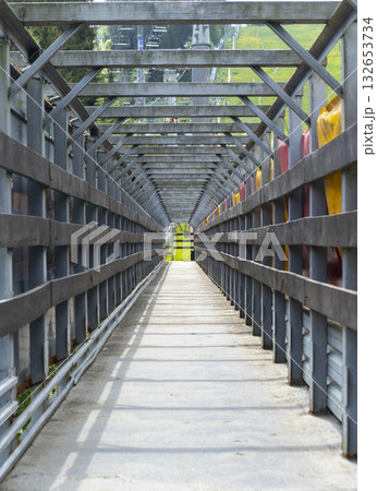 perspective view of a corridor made of planks outdoor 132653734