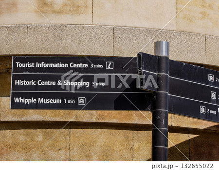 Close up view of a signpost indicating directions and walking times to points of interest in Cambridge, UK Close up view of a signpost indicating directions and walking times to points of interest in Cambridge, UK 132655022
