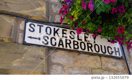 Road sign to Stokesley and Scarborough showing directions in Helmsley, North York Moors National Park Road sign to Stokesley and Scarborough showing directions in Helmsley, North York Moors National Park 132655079