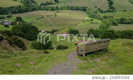 Empty bench overlooking green valley in North York Moors National Park, UK Empty bench overlooking green valley in North York Moors National Park, UK 132655102