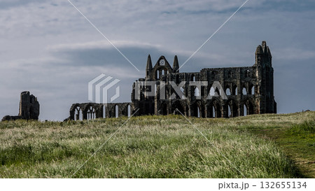 Whitby Abbey rising over North York Moors National Park in England Whitby Abbey rising over North York Moors National Park in England 132655134
