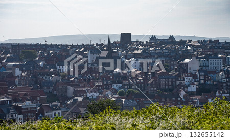 Whitby cityscape overlooking rooftops and North York Moors National Park 132655142