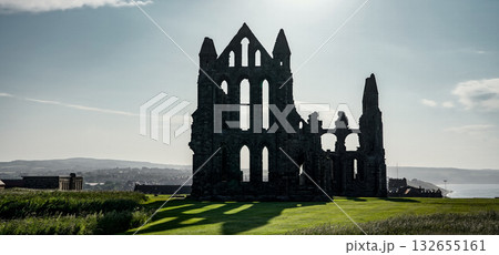 Whitby Abbey dominating the landscape in North York Moors National Park, United Kingdom Whitby Abbey dominating the landscape in North York Moors National Park, United Kingdom 132655161