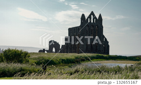 Whitby Abbey rising over North York Moors National Park in Yorkshire, England Whitby Abbey rising over North York Moors National Park in Yorkshire, England 132655167