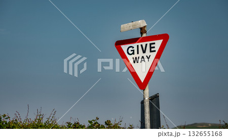 Give way sign indicating right of way in Whitby, North York Moors National Park, UK 132655168