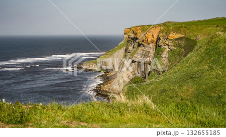 Scenic view of Whitby cliffs meeting North Sea in North York Moors National Park Scenic view of Whitby cliffs meeting North Sea in North York Moors National Park 132655185