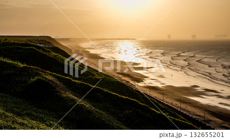 Golden sunset illuminating Saltburn by the Sea beach and coastline in United Kingdom Golden sunset illuminating Saltburn by the Sea beach and coastline in United Kingdom 132655201
