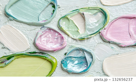 Macro detail of thick pastel oil paint swatches with heavy texture and vibrant blue, pink, and lime green colors. An artistic, creamy, and abstract background. AI Generated 132656237
