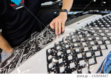 Applying a Protective Film on the Surface of Your Car for Enhanced Durability and Shine 132656927