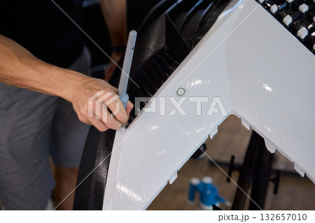 Applying a Protective Film on the Surface of Your Car for Enhanced Durability and Shine 132657010