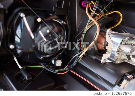Careful precision is essential when installing a car headlight assembly for optimal performance Careful precision is essential when installing a car headlight assembly for optimal performance 132657670