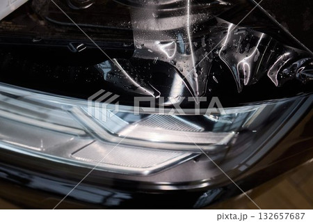 Applying a Protective Film on the Surface of Your Car for Enhanced Durability and Shine 132657687