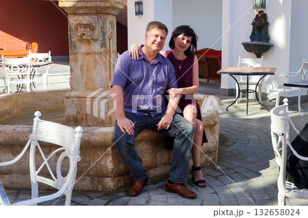 Beautiful married adult couple husband and wife in a street Italian restaurant Beautiful married adult couple husband and wife in a street Italian restaurant 132658024