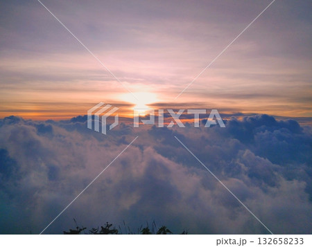 Golden Sunset or Sunrise Above a Magnificent Sea of Clouds Golden Sunset or Sunrise Above a Magnificent Sea of Clouds 132658233