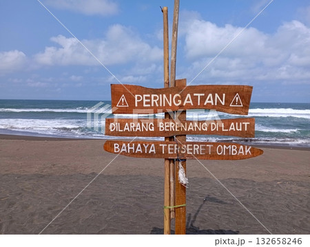 Indonesian Warning Sign at Beach Danger of Riptides Indonesian Warning Sign at Beach Danger of Riptides 132658246