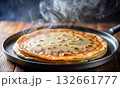 Close-up of a delicious, freshly cooked pancake on a hot frying pan 132661777