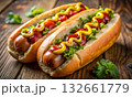 Close-up view of tasty hot dogs with ketchup and mayonnaise 132661779