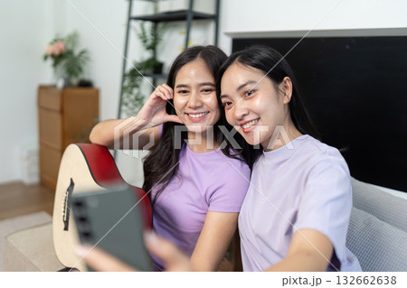 LGBTQIA Friends Taking Selfie with Guitar at Home 132662638