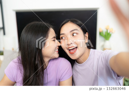 LGBTQ couple capturing a playful selfie together at home 132663046