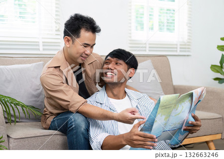 Travel Planning and Couple Bonding. A loving couple exploring a map together, planning their next adventure. Travel Planning and Couple Bonding. A loving couple exploring a map together, planning their next adventure. 132663246