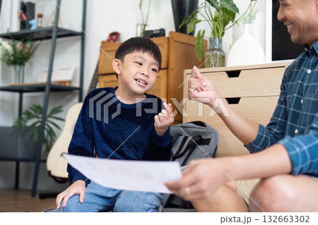 Back to School Learning. Engaging father and son enjoying study time at home. Back to School Learning. Engaging father and son enjoying study time at home. 132663302