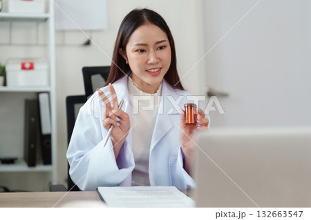 Patient Interaction and Care Communication. A healthcare provider shares important health information with a patient online. 132663547
