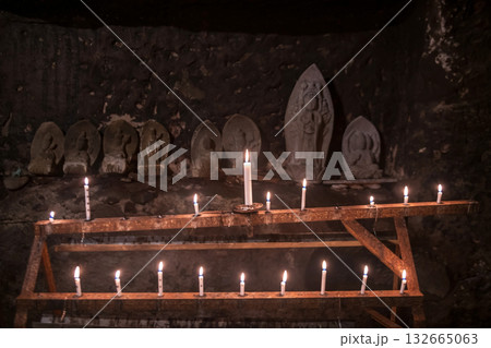 candles glow cave by Buddha statue of Okunoin at Futagoji, Oita candles glow cave by Buddha statue of Okunoin at Futagoji, Oita 132665063