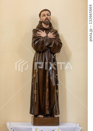 An Elegant and Detailed Statue Beautifully Depicting a Saint Wearing Exquisite and Luxurious Robes 132665664