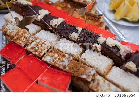 An Exquisite Colorful Dessert Platter Featuring a Whimsical Variety of Delicious Sweets 132665954