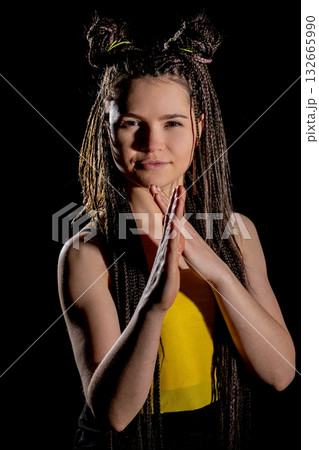 A young woman showcasing a unique hairstyle and a vibrant outfit that stands out A young woman showcasing a unique hairstyle and a vibrant outfit that stands out 132665990