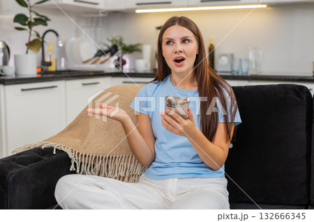 Young woman learns language on smartphone repeats phrases gets score streak and celebrates progress Young woman learns language on smartphone repeats phrases gets score streak and celebrates progress 132666345