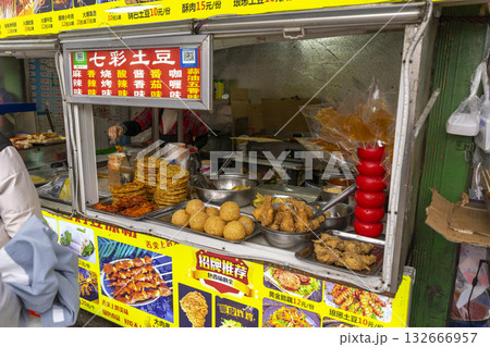 Lijiang, China - April 12, 2024 : Local food stall shop at flea market in Lijiang Old Town, China on April 12, 2024. 132666957