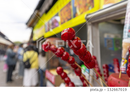 Lijiang, China - April 12, 2024 : Local food stall shop at flea market in Lijiang Old Town, China on April 12, 2024. 132667019