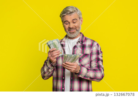 Mature man counting dollar money cash, satisfied smile, showing profit bonus wage financial success Mature man counting dollar money cash, satisfied smile, showing profit bonus wage financial success 132667078