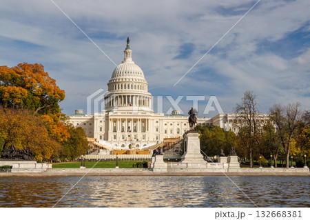 The U.S. Capitol in Washington, D.C., surrounded by vibrant autumn foliage 132668381