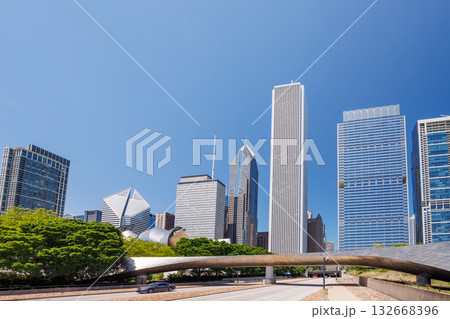 Vibrant sunny view of Chicago downtown skyline under a blue sky Vibrant sunny view of Chicago downtown skyline under a blue sky 132668396